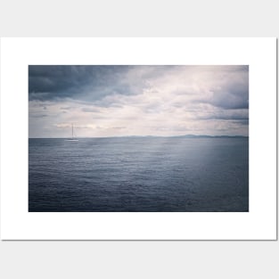 Panoramic seascape with a sailboat on the horizon Posters and Art